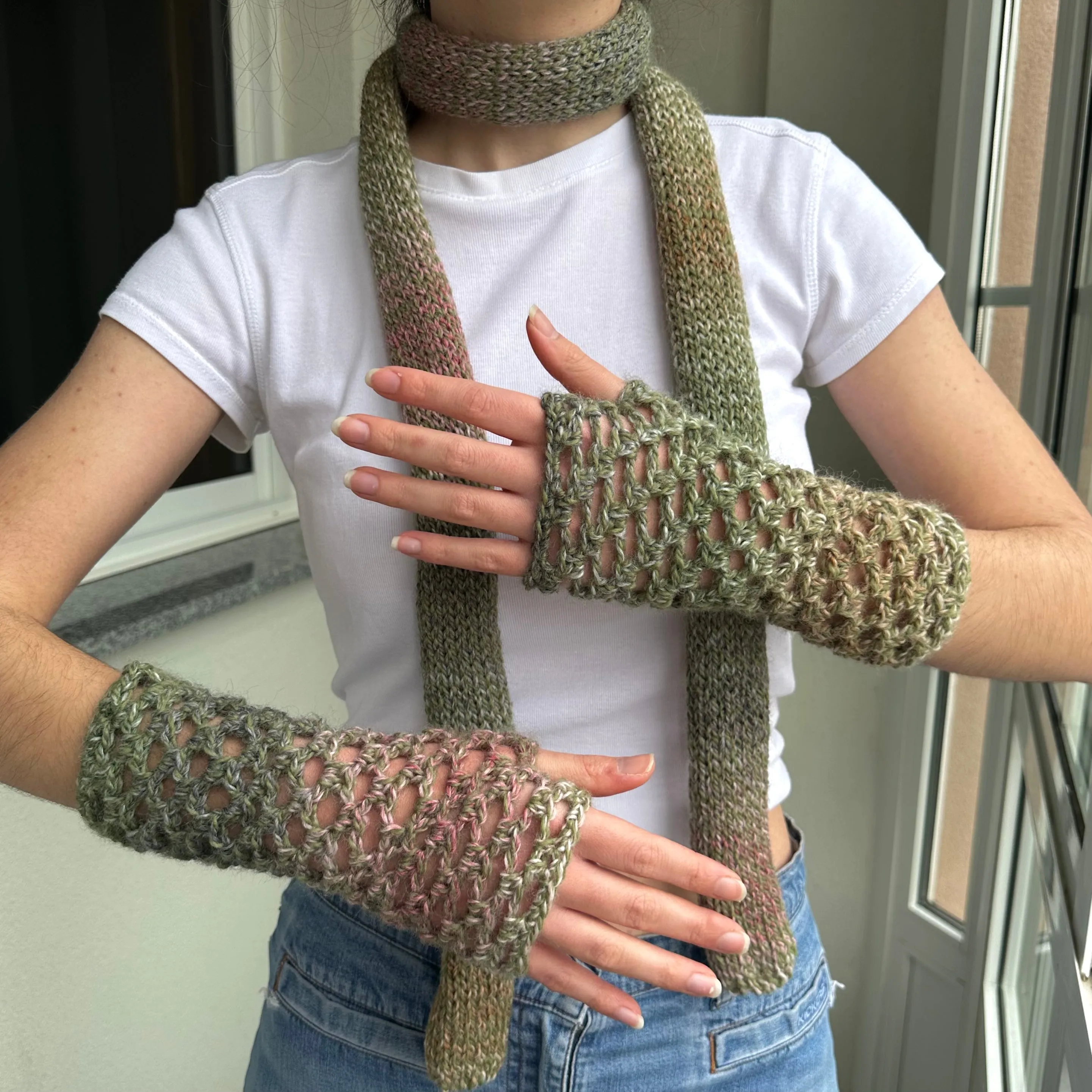 Handmade dusky pink and green crochet fishnet hand warmers