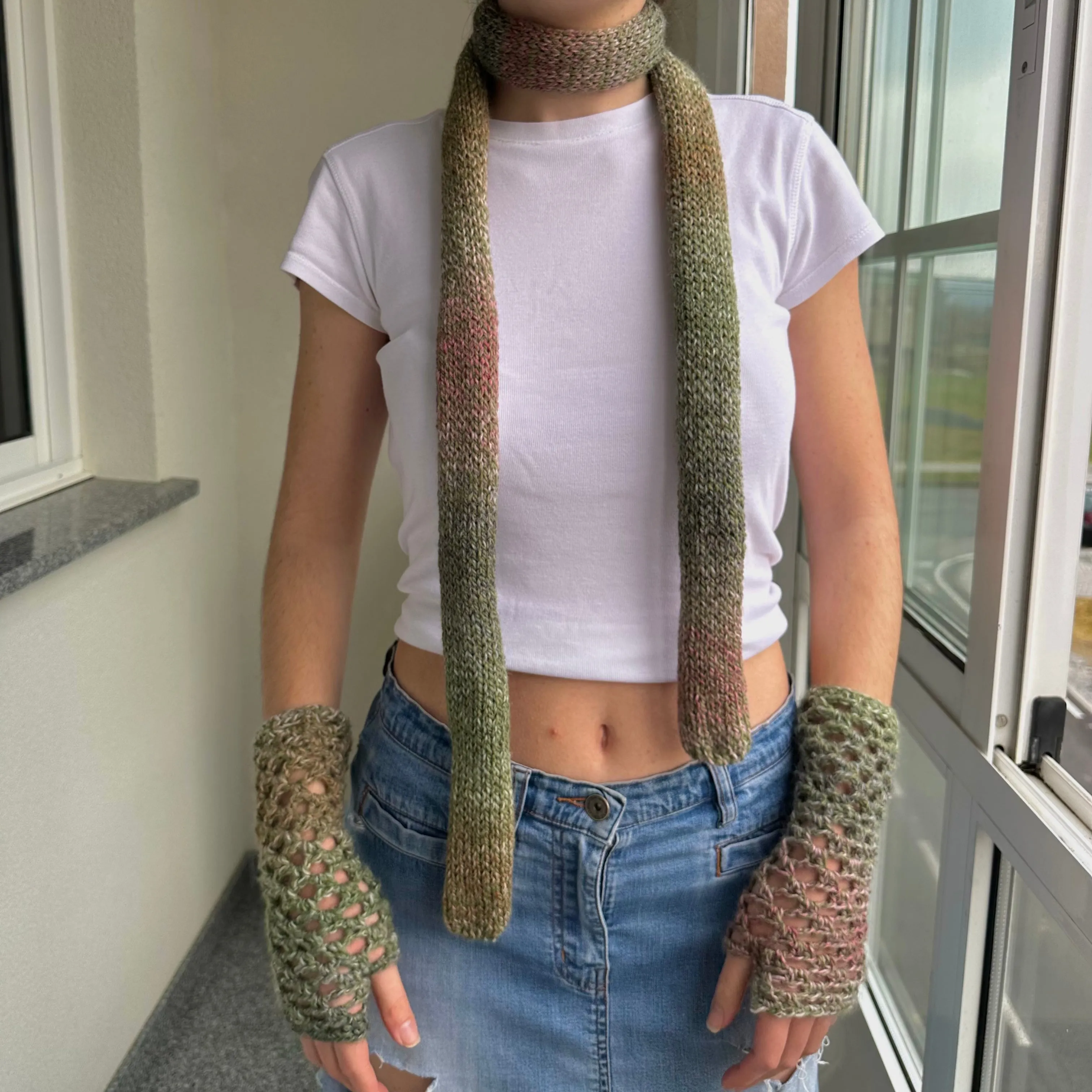 Handmade dusky pink and green crochet fishnet hand warmers